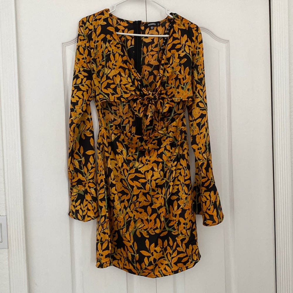 Missguided size 10 dress, slit in the middle, cool pattern with bell sleeves.